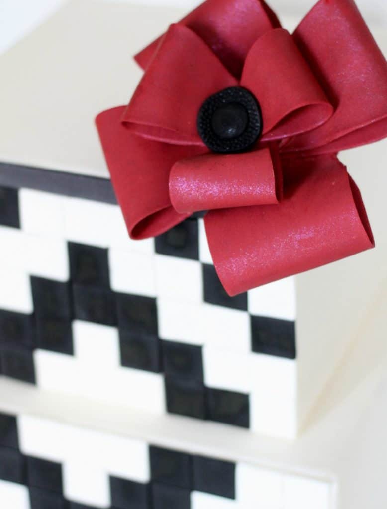 Fondant Looped Bow on top corner of geometric black and white cake